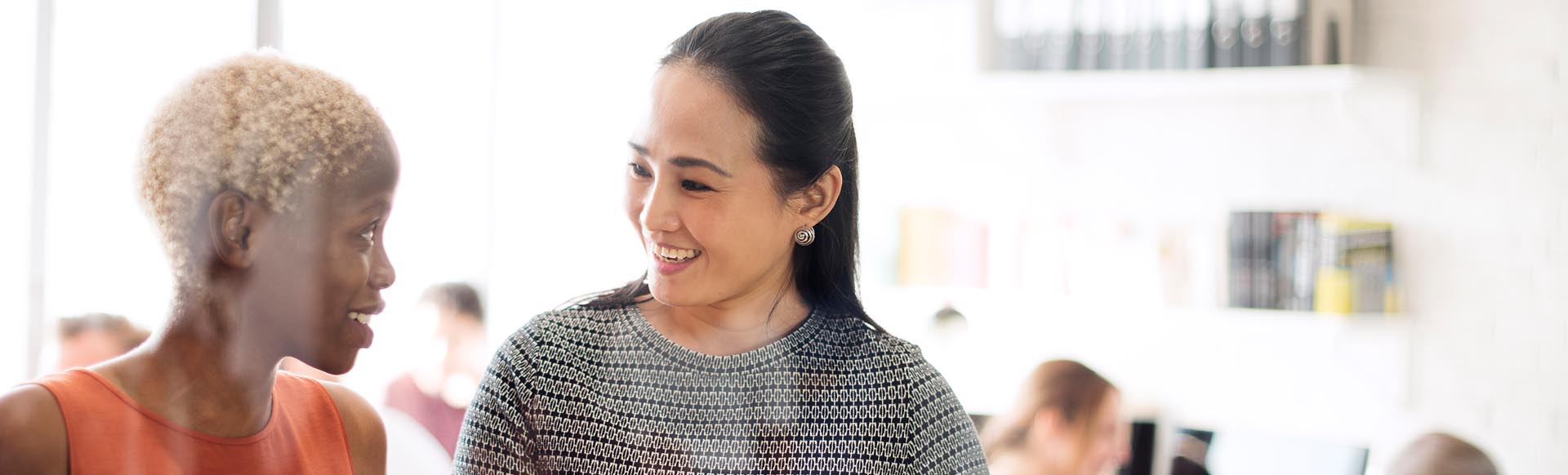 two business women interacting