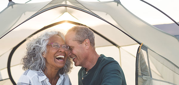 Medicare aged couple laughing together